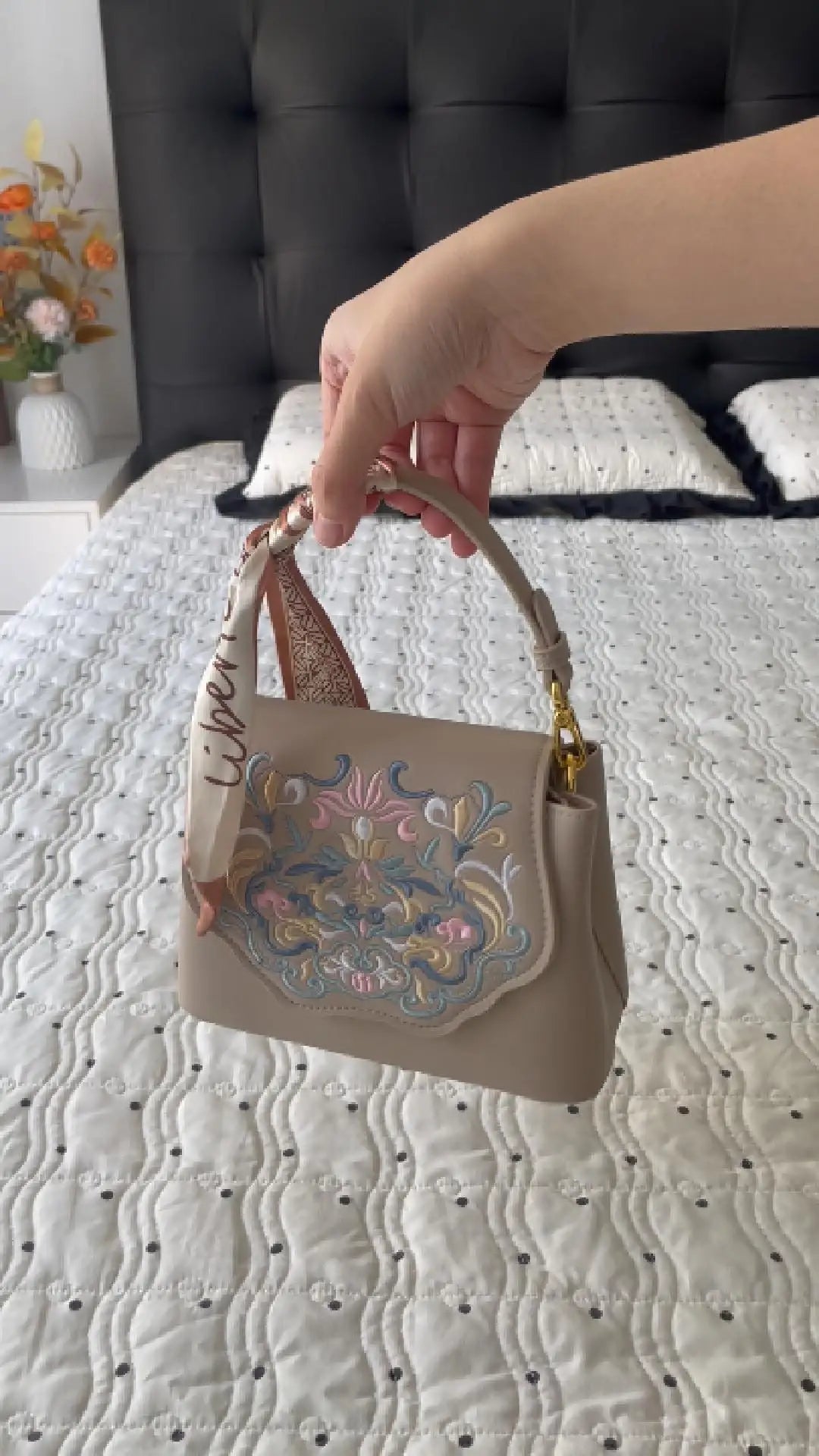 Load video: showcase an embroidered crossbody bag