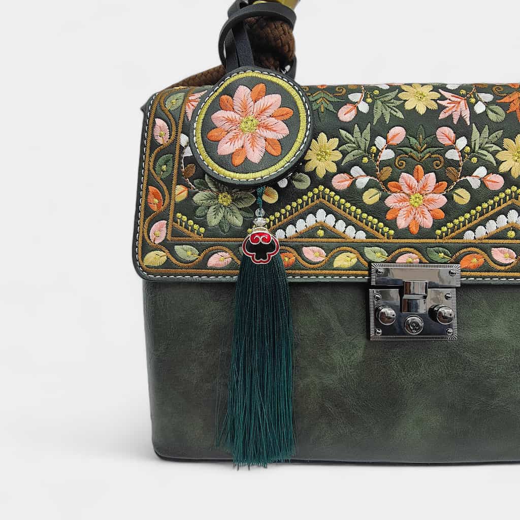floral-embroidered-message-bag-PU-leather-with-top-handle-and-tassels-detail