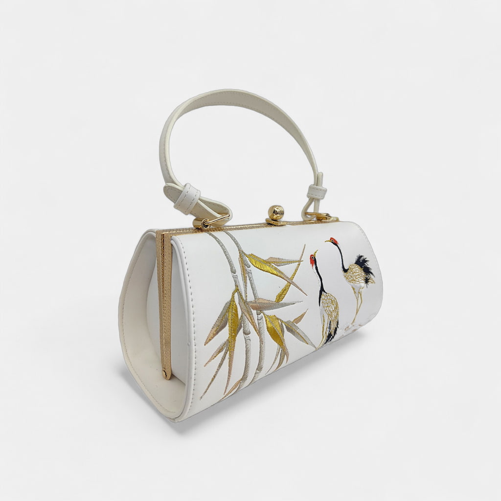 vintage-crane-embroidered-women-barrel-bag-with-tassels-left-front