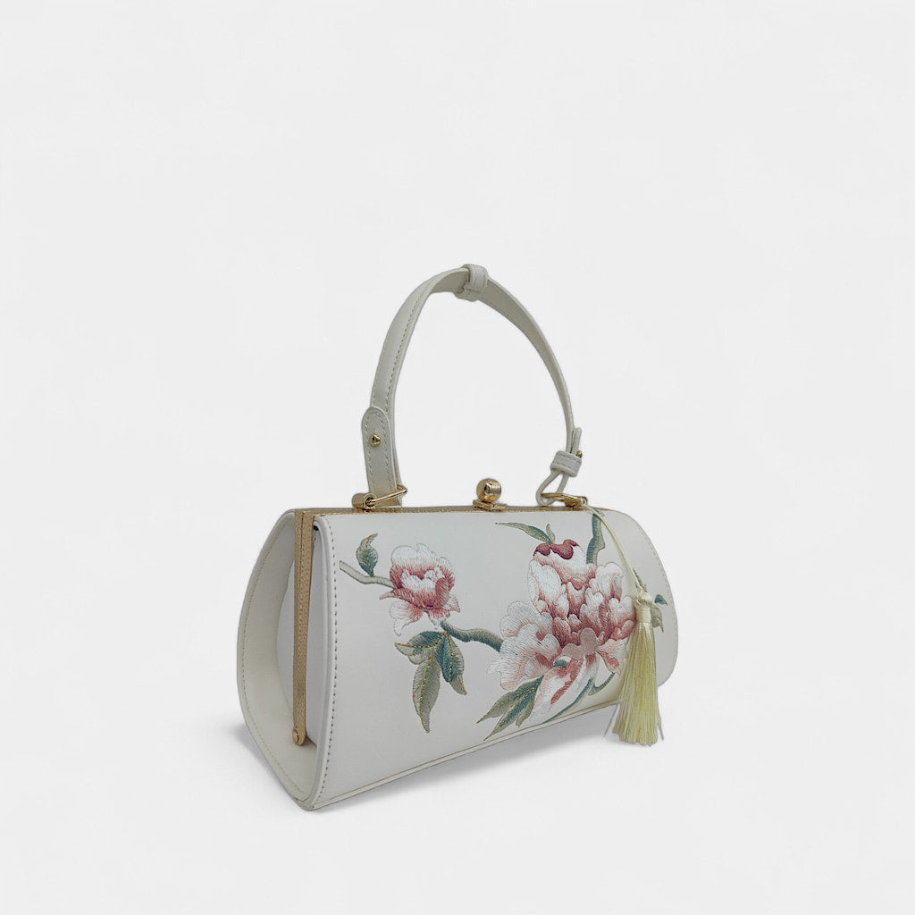 vintage-peony-embroidered-women-barrel-bag-with-tassels-left-front
