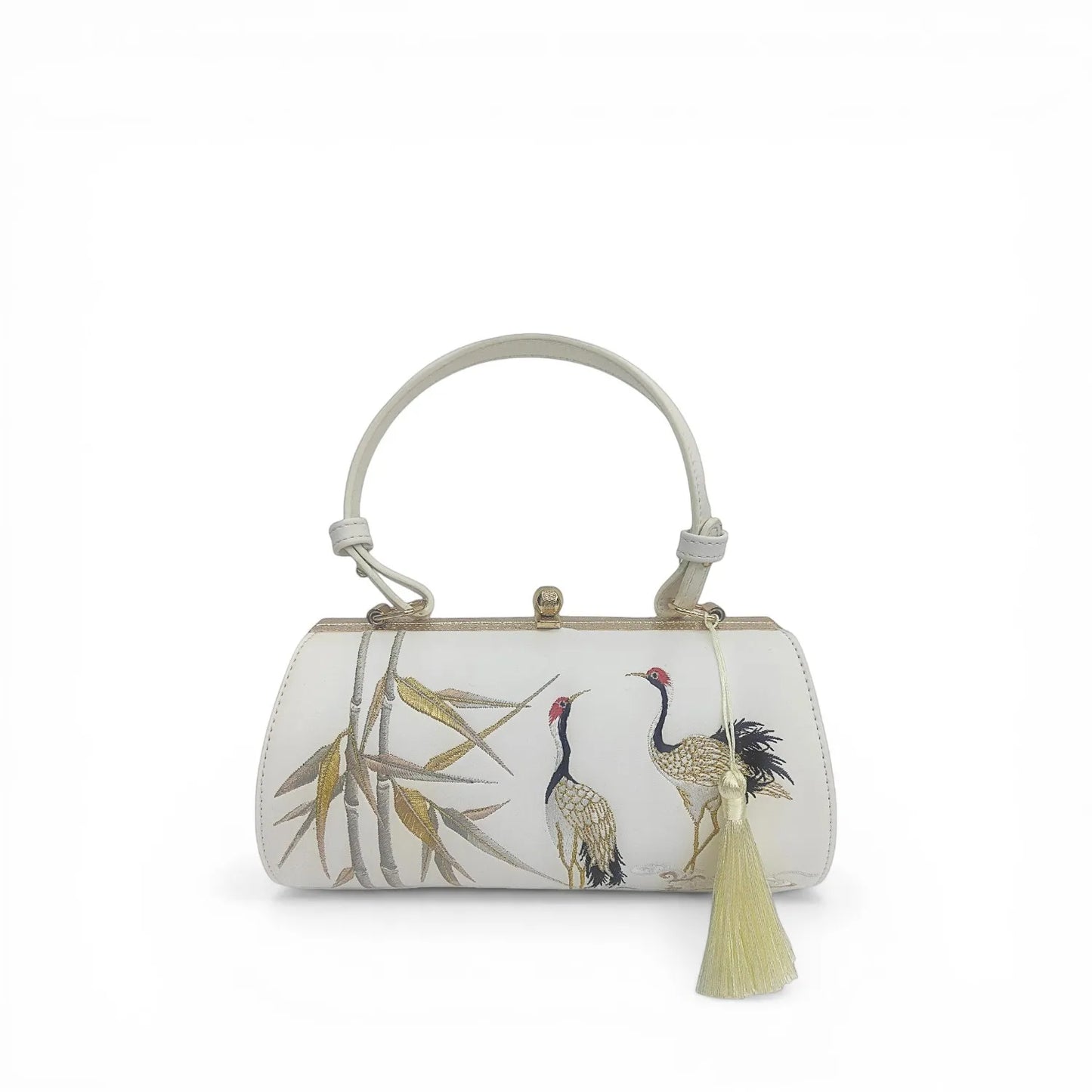front view of white pu leather clutch bag with chinese crane and bamboo embroidery, tassel detail and top handle